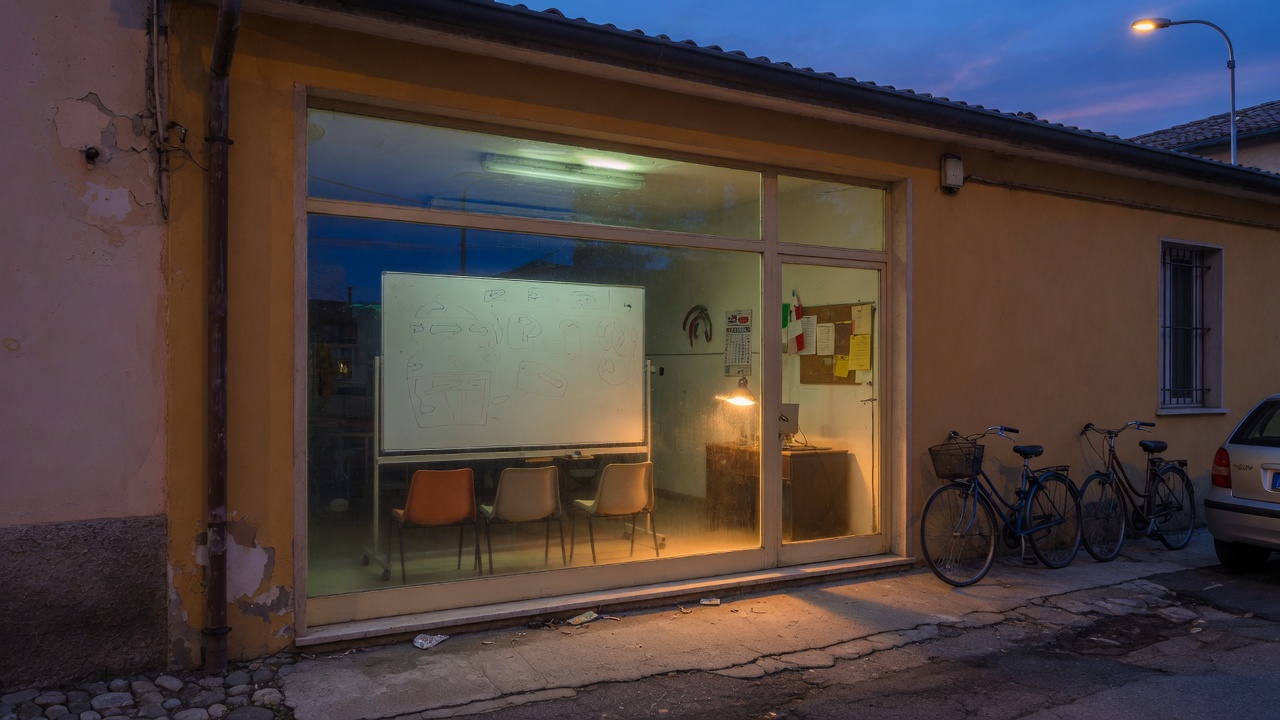 The lit front window of a provincial driving school at dusk